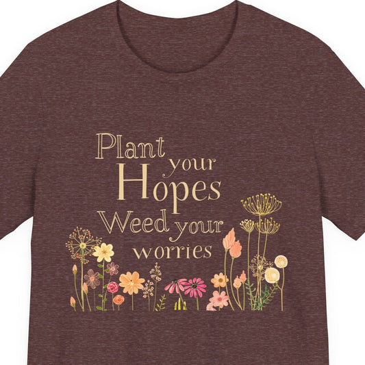 Brown t-shirt with floral design and text on a white background