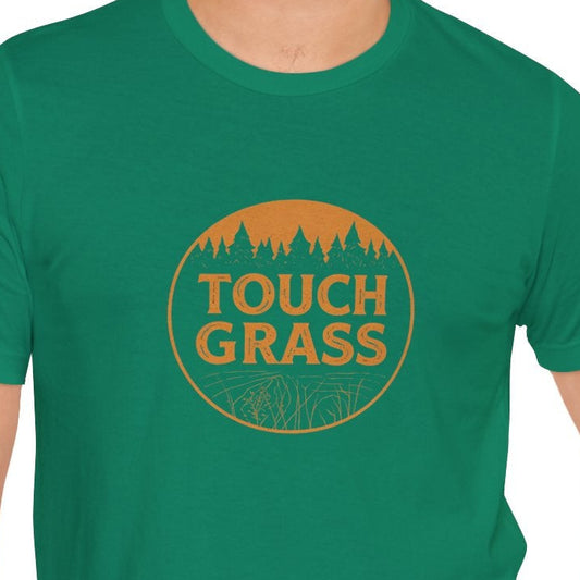Man wearing a green t-shirt with 'Touch Grass' logo on a white background