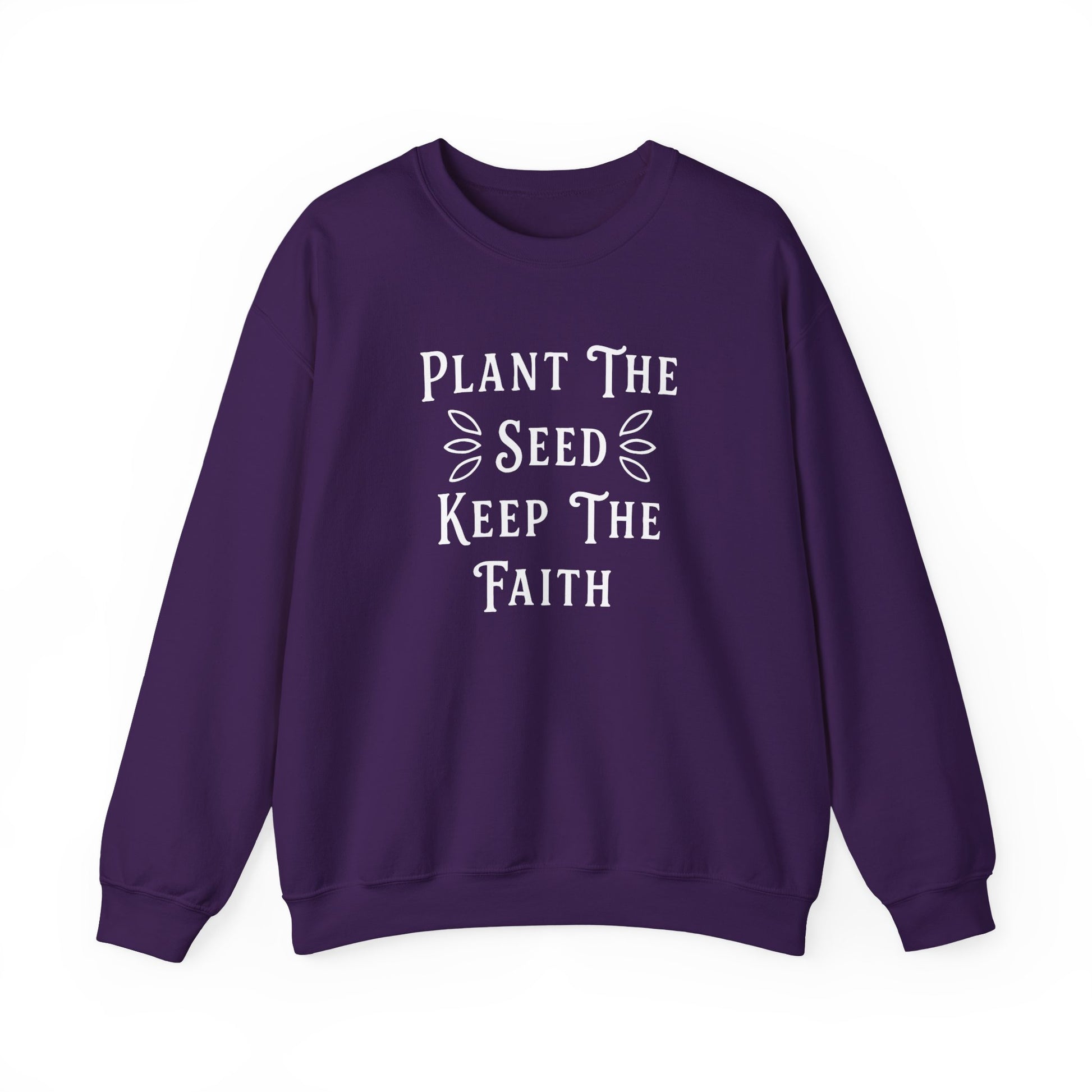 Purple sweatshirt with 'Plant The Seed Keep The Faith' text on a white background