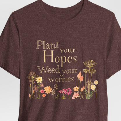 Brown t-shirt with floral design and text on a white background