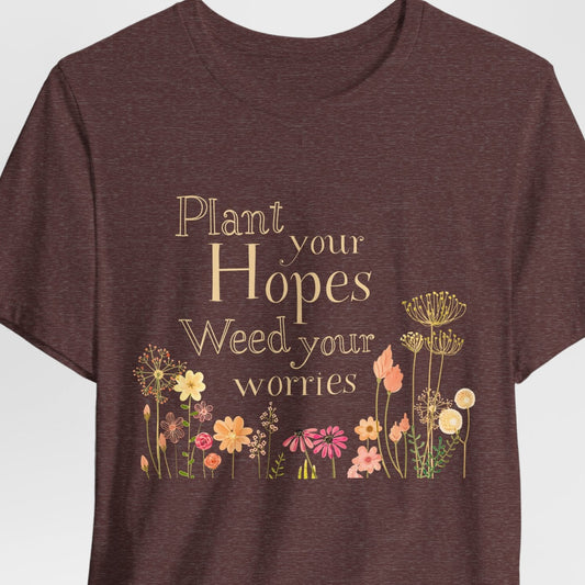 Brown t-shirt with floral design and text on a white background